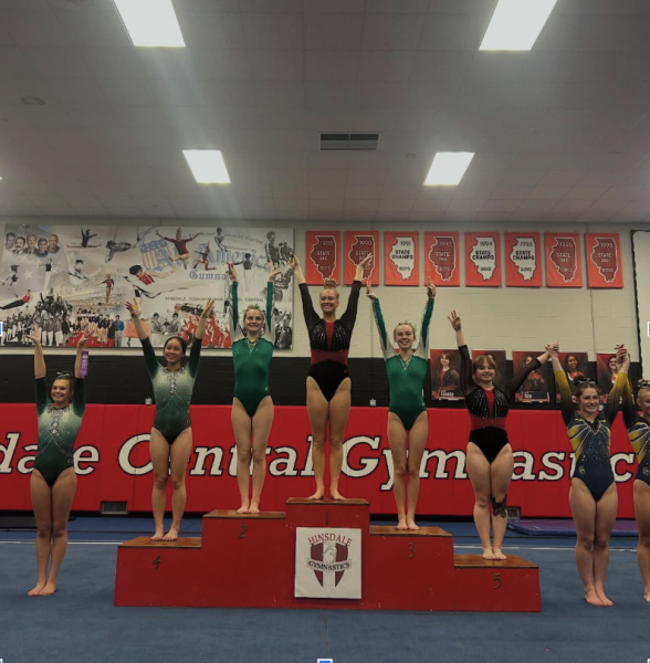 Two of the gymnasts on the Hinsdale Central girls gymnastics team, Lane Inabnit, junior, and Kennedy Hannah, senior, placed first and fifth respectively for the beam event during the conference meet.  
